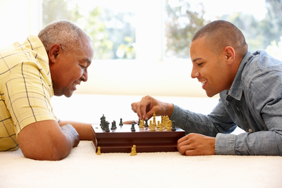 Men playing chess. Brain enhancing games help to prevent symptoms of alzheimer's disease.
